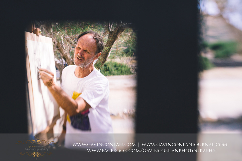  The wedding party taking an art lesson by  Visual Arts Crete &nbsp;and showcasing their artisic talent in Crete, Greece by  gavin conlan photography Ltd  