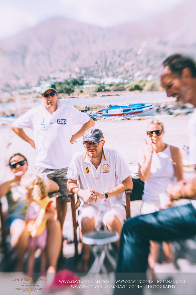 The wedding party taking an art lesson by Visual Arts Crete and showcasing their artisic talent in Crete, Greece by gavin conlan photography Ltd