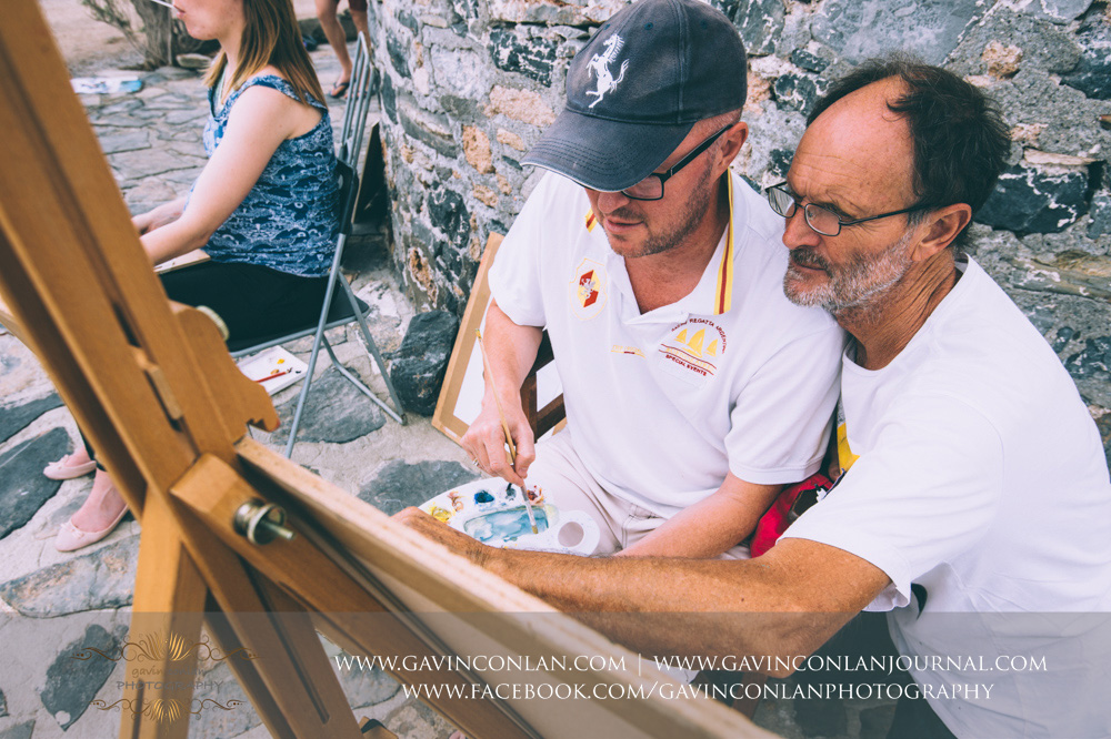  The wedding party taking an art lesson by  Visual Arts Crete &nbsp;and showcasing their artisic talent in Crete, Greece by  gavin conlan photography Ltd  