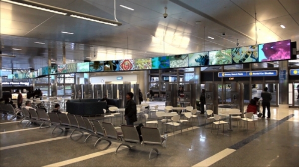 Play document of SPLASH, a 28-channel video installation at the Tom Bradley International Terminal at the Los Angeles International Airport