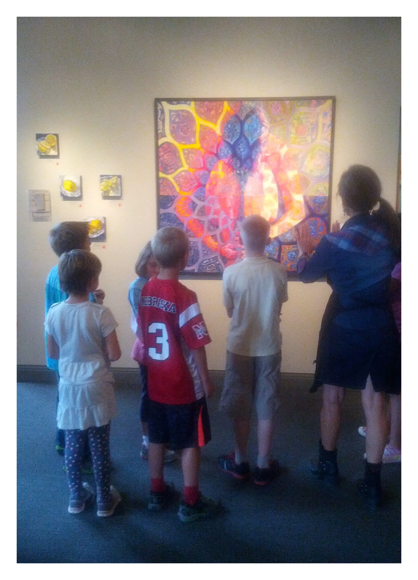  After-School Art Program students discuss the elements of art as they explore Yelena Khanevskaya's paintings. &nbsp;September 2014. 