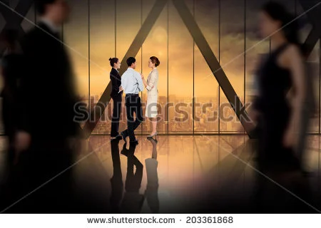 stock-photo-business-colleagues-talking-against-room-with-large-window-looking-on-city-203361868.jpg