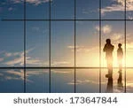 stock-photo-silhouettes-of-businesspeople-standing-against-panoramic-office-window-173647844.jpg