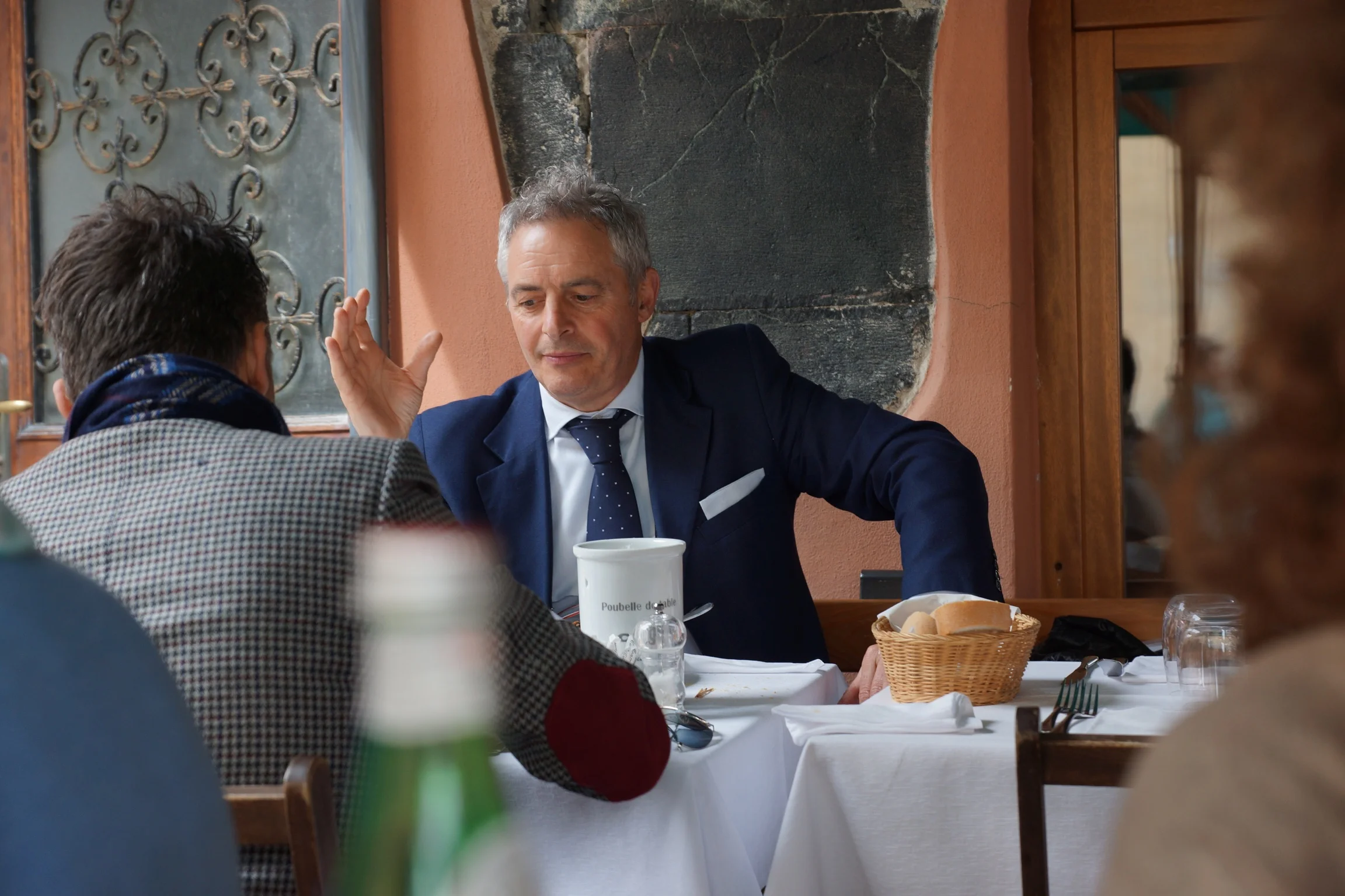 Some Italian men having lunch behind me at Ristorante Ciak in Monterosso . Note the ties and scarves even in a beach town. I love the way Italians and French dress!