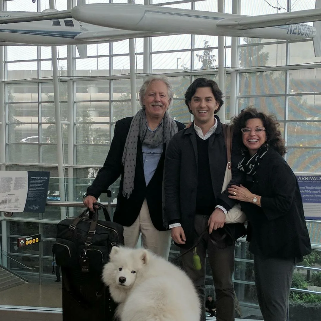 Saying goodbye to Nick at the airport. We're smiling to keep from crying.