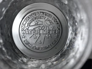 New Orleans manhole cover design in a glass