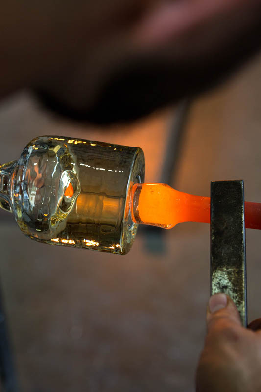 Attaching the punty, the process known as transferring, where the bubble it attached to a new handle on the bottom and the lip can be shaped
