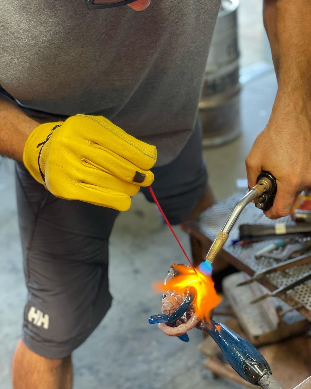 Markus drawing on the glass heart in the hot shop