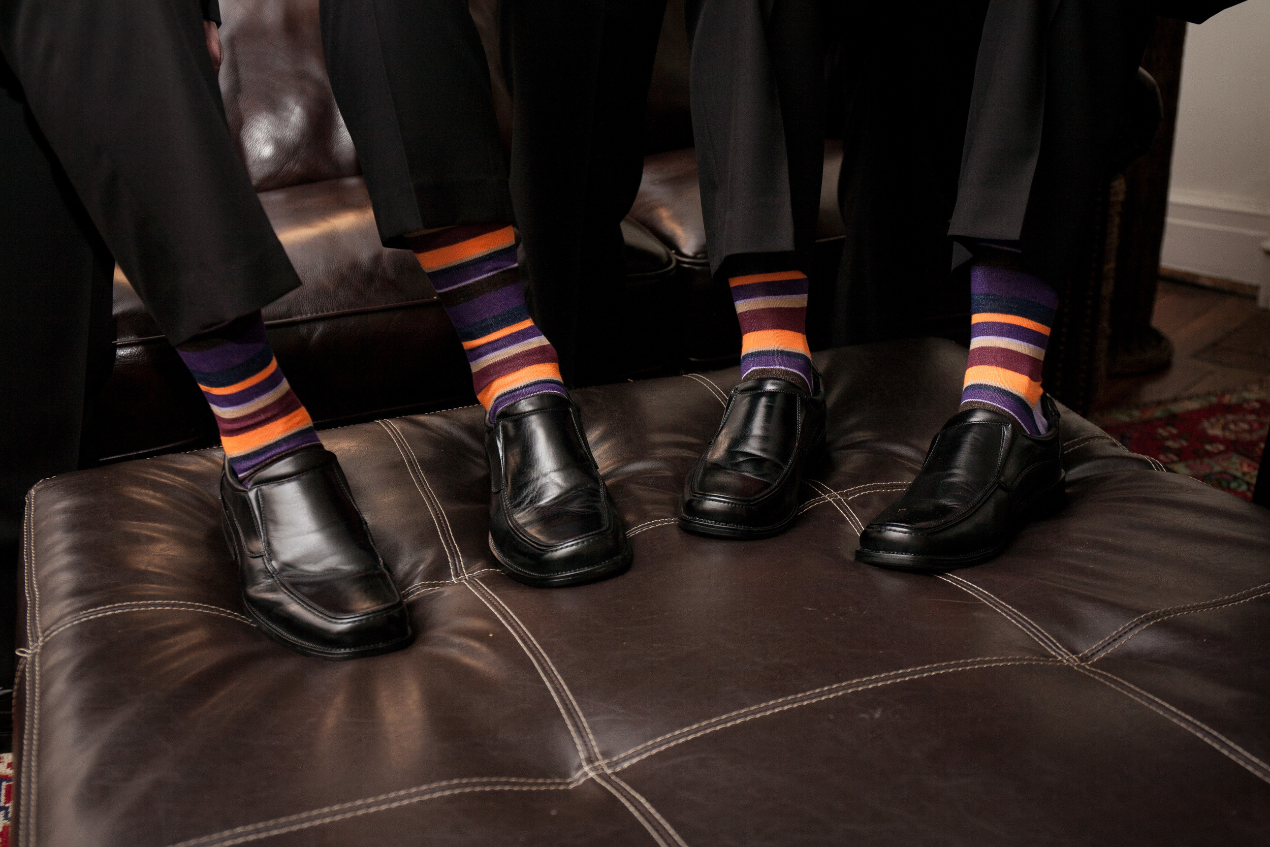 The Kyle House Fincastle Virginia Wedding Photographer Bent-Lee Carr groom and groomsmen showing off their fun socks
