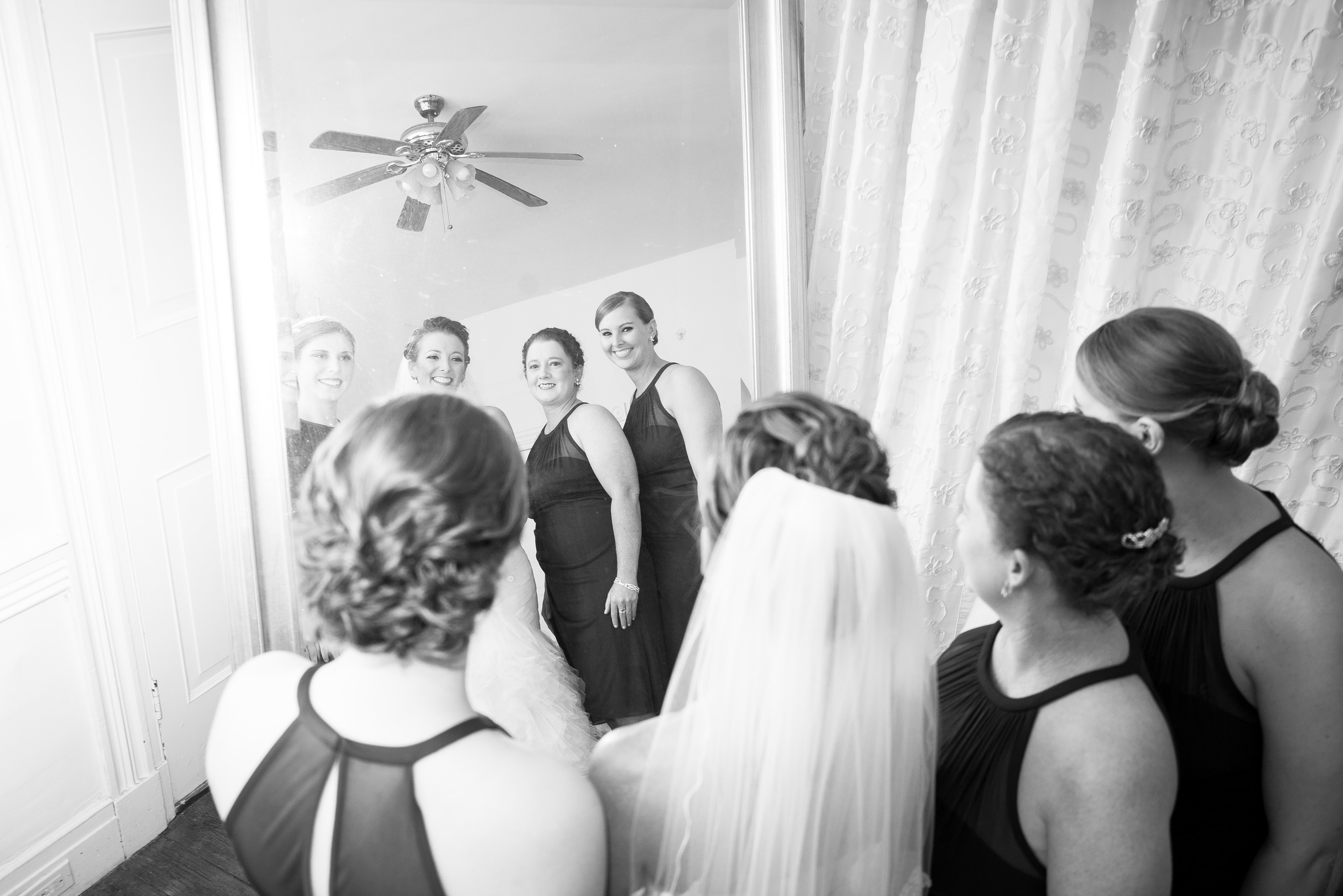 The Kyle House Fincastle Virginia Wedding Photographer Bent-Lee Carr bride and bridesmaids giving a final glance in the mirror