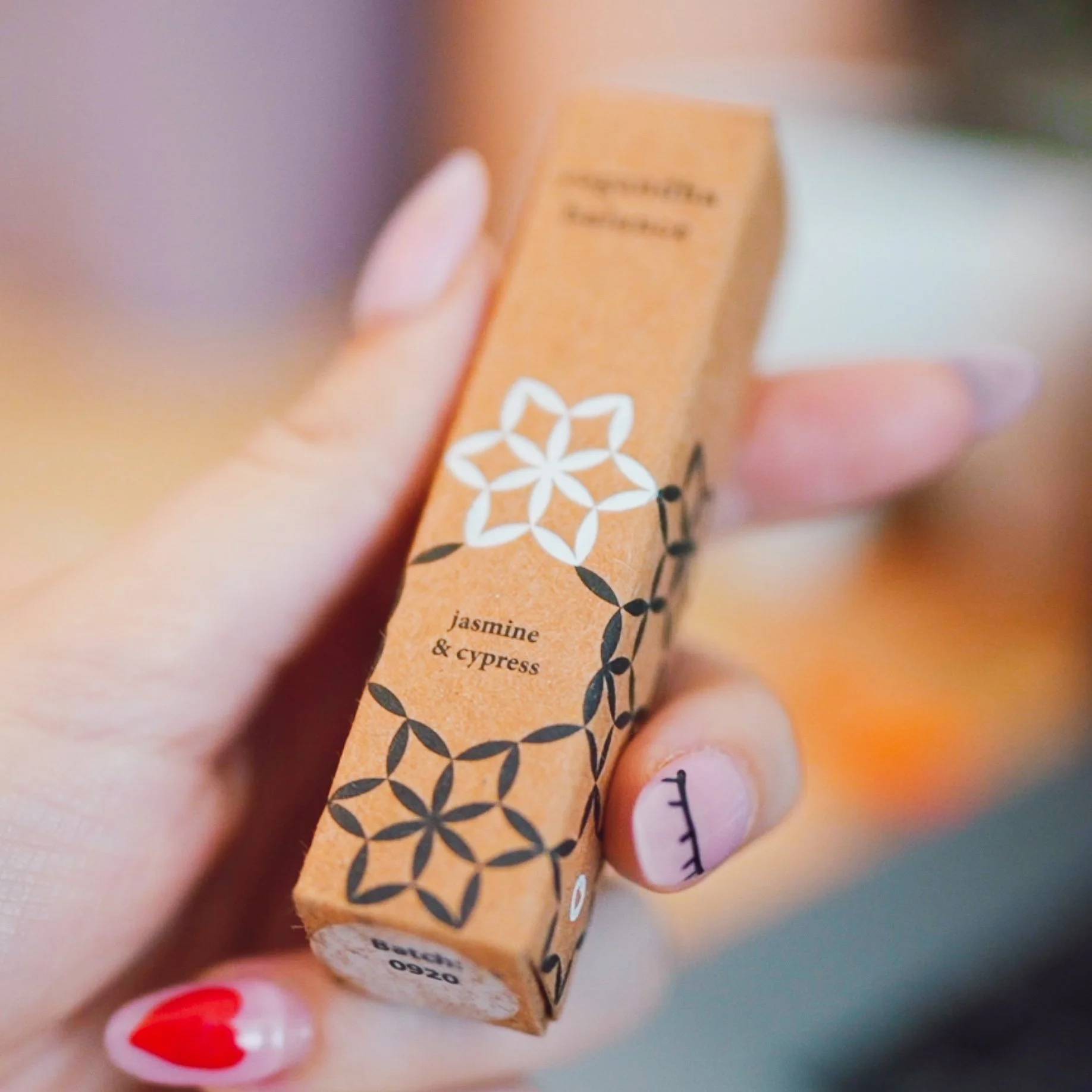 balance roll on inside the package box being held by a girl with pink nails.jpg