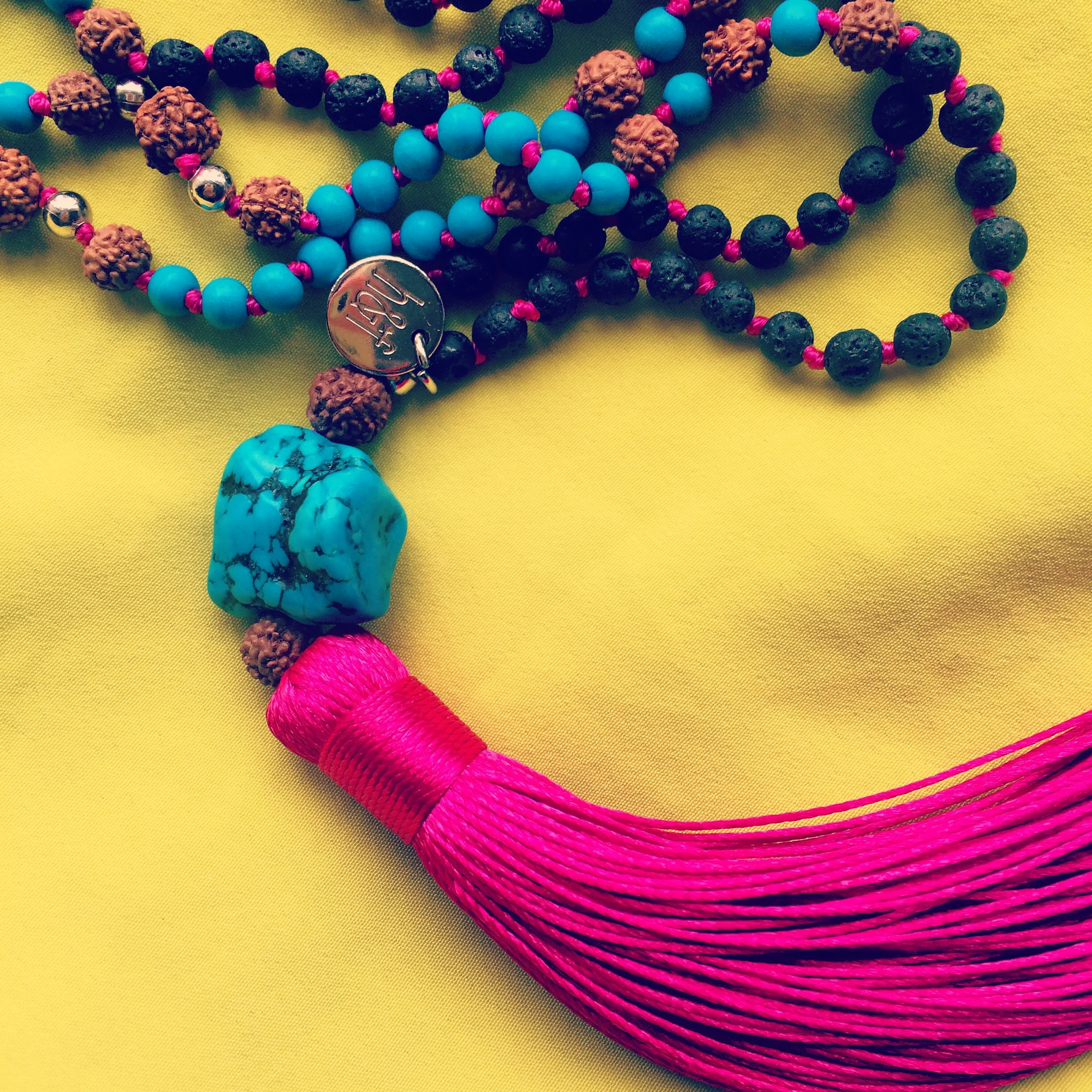 Helix and Felix cerise pink tassel necklace.