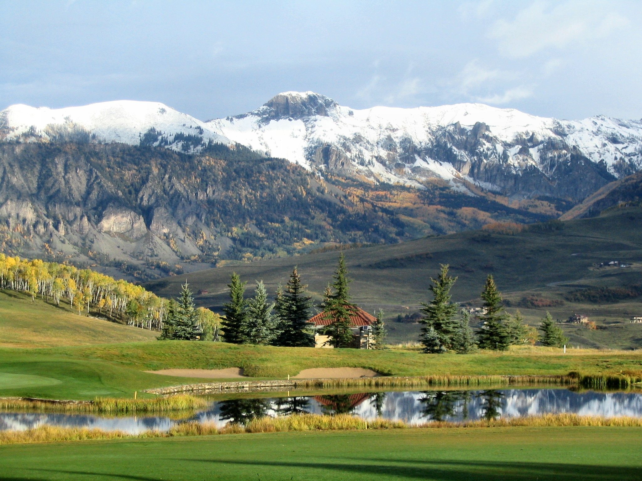 photo of a peaceful meadow and mountains
