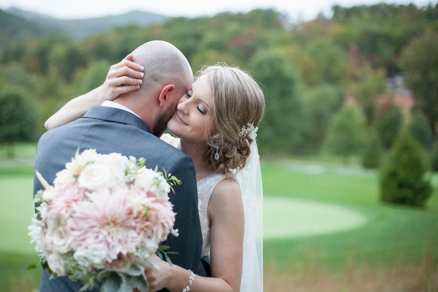 Courtney and Bobby got married at the beautiful Cliffs at Walnut Cove just south of Asheville. Unfortunately it rained on their wedding day and they were forced to perform the ceremony under a tent, but it cleared up just long enough for us to grab a few shots of the two of them alone in this gorgeous setting. I just love how the cloudy weather lets the color pop. And the romanticism between these two is just undeniable. For more images from this wedding check out the full blog post here !