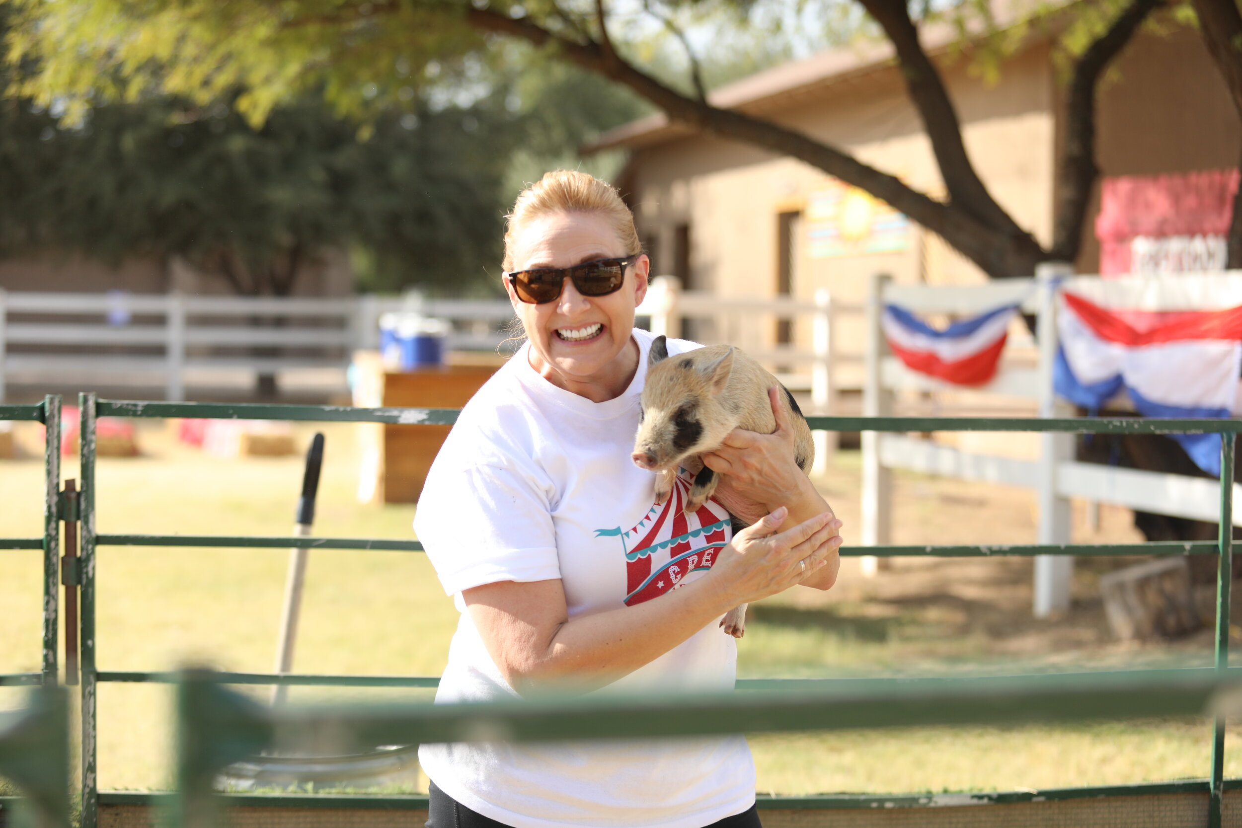 Ms. Brenda and an adorable piglet!