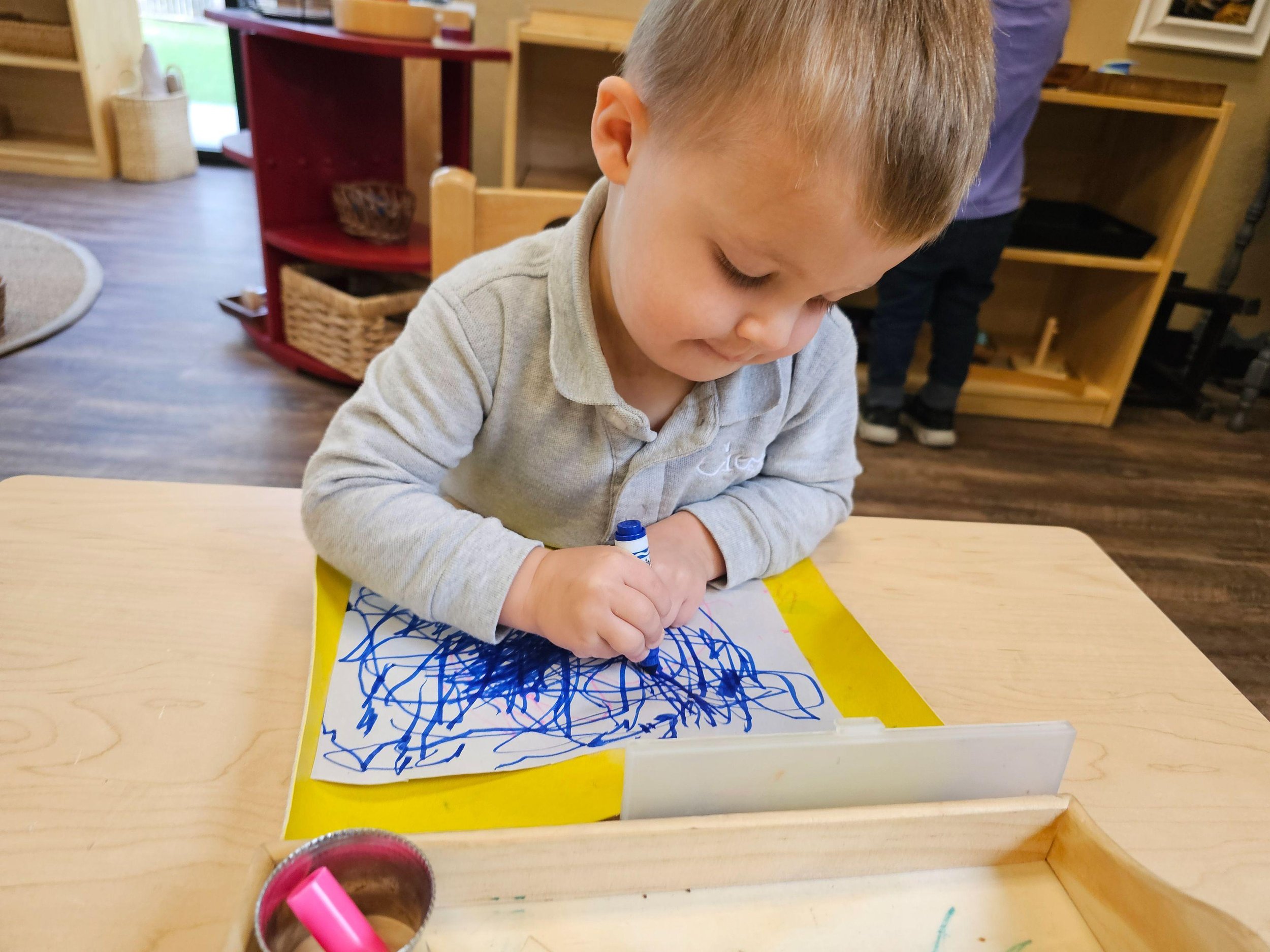 Parker scribbling with markers.jpg