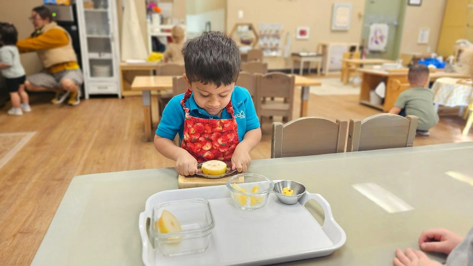 Shivam slicing pears.jpg