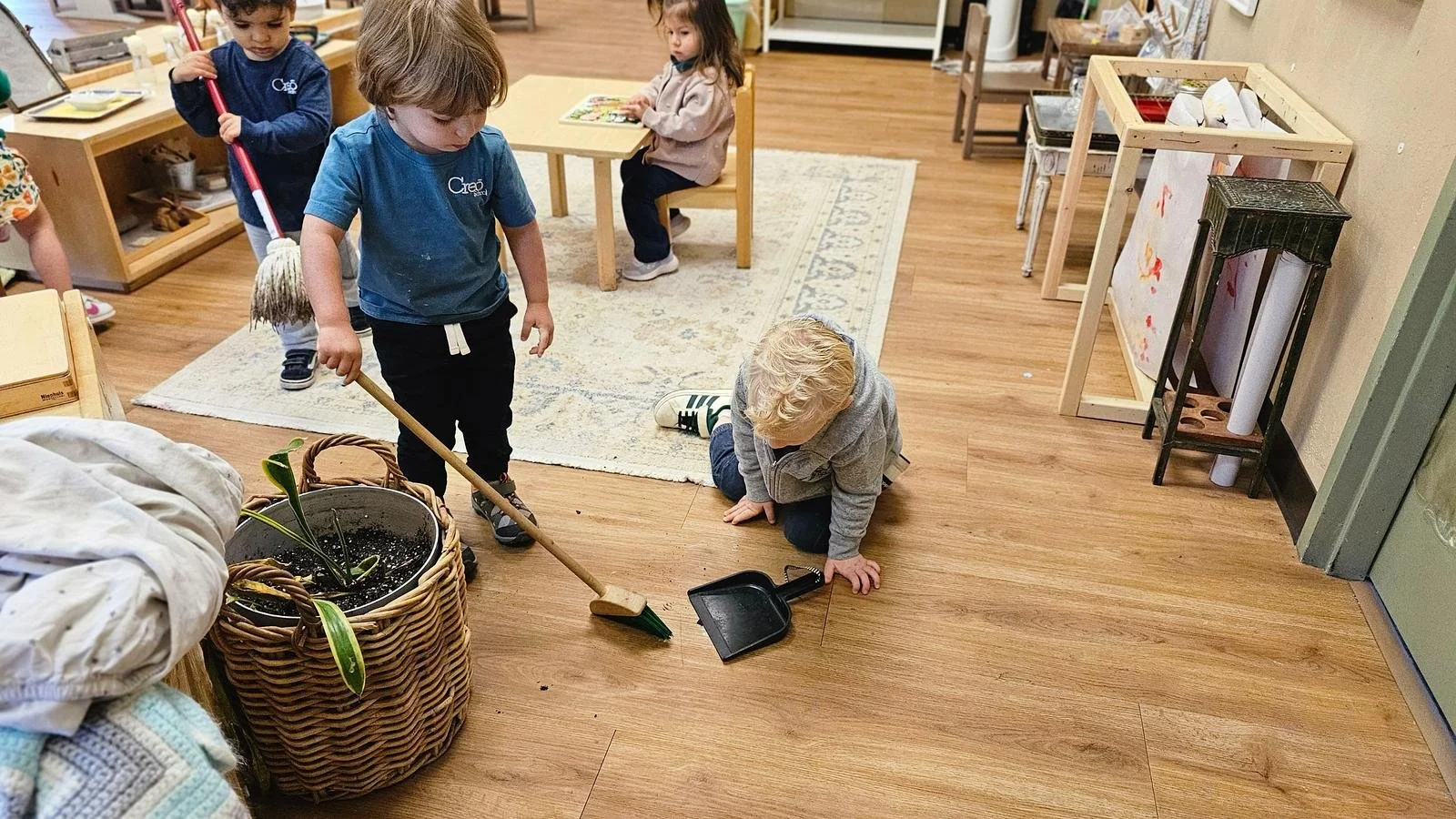Lincoln and Oliver sweeping dirt.jpg