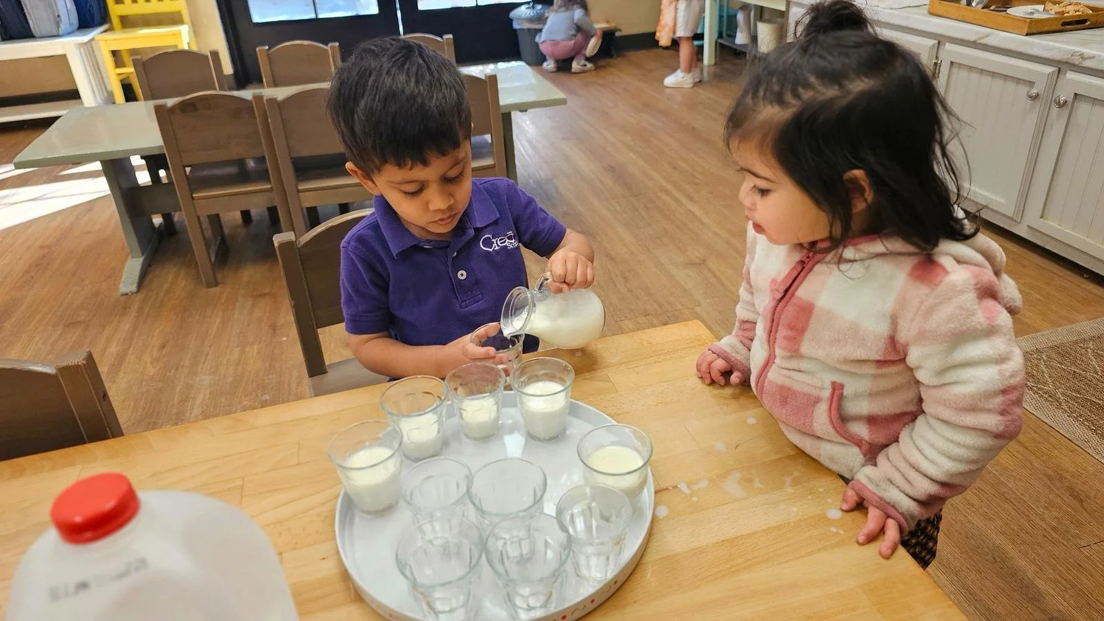 Shivam pouring milk.jpg