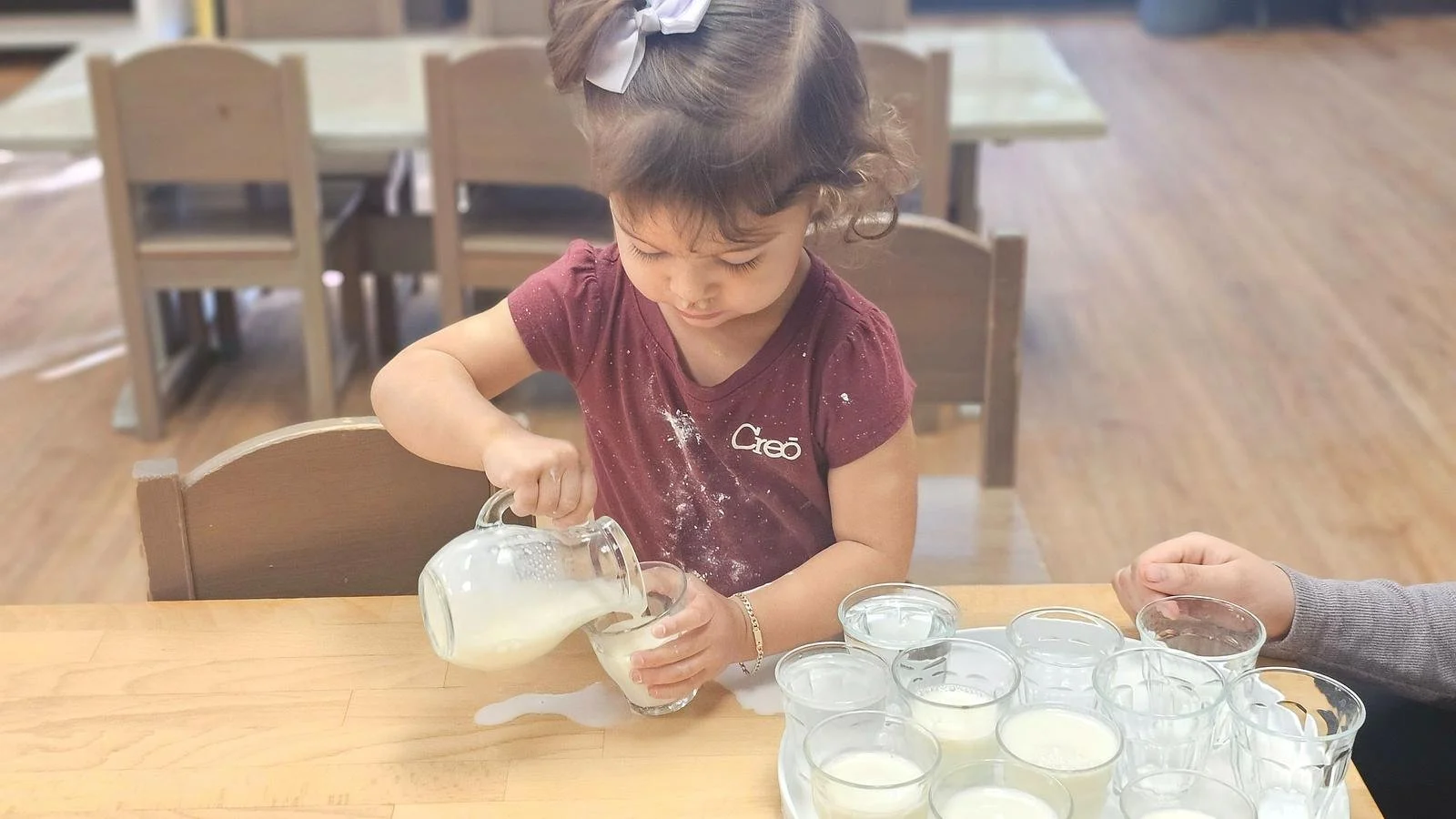 Alana pouring milk.jpg