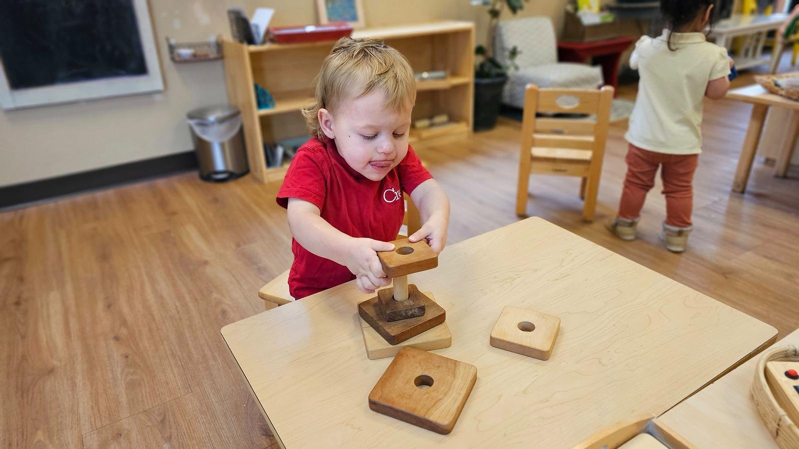 Beckham wooden rings on vertical dowel.jpg