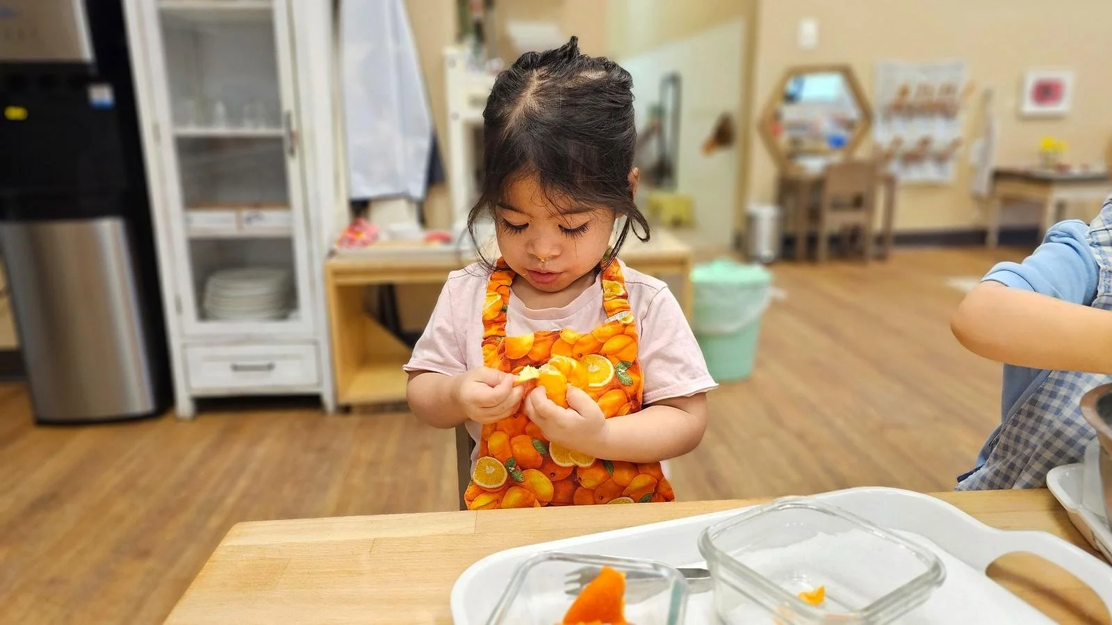 Avery peeling orange.jpg