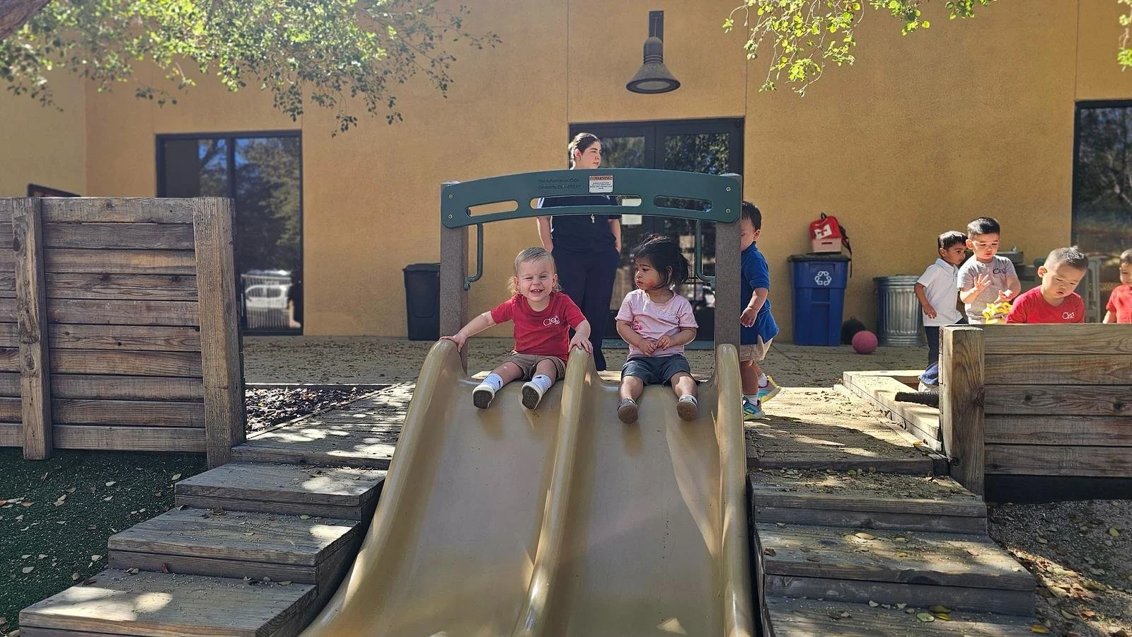 Beckham and Avery going down the slide.jpg
