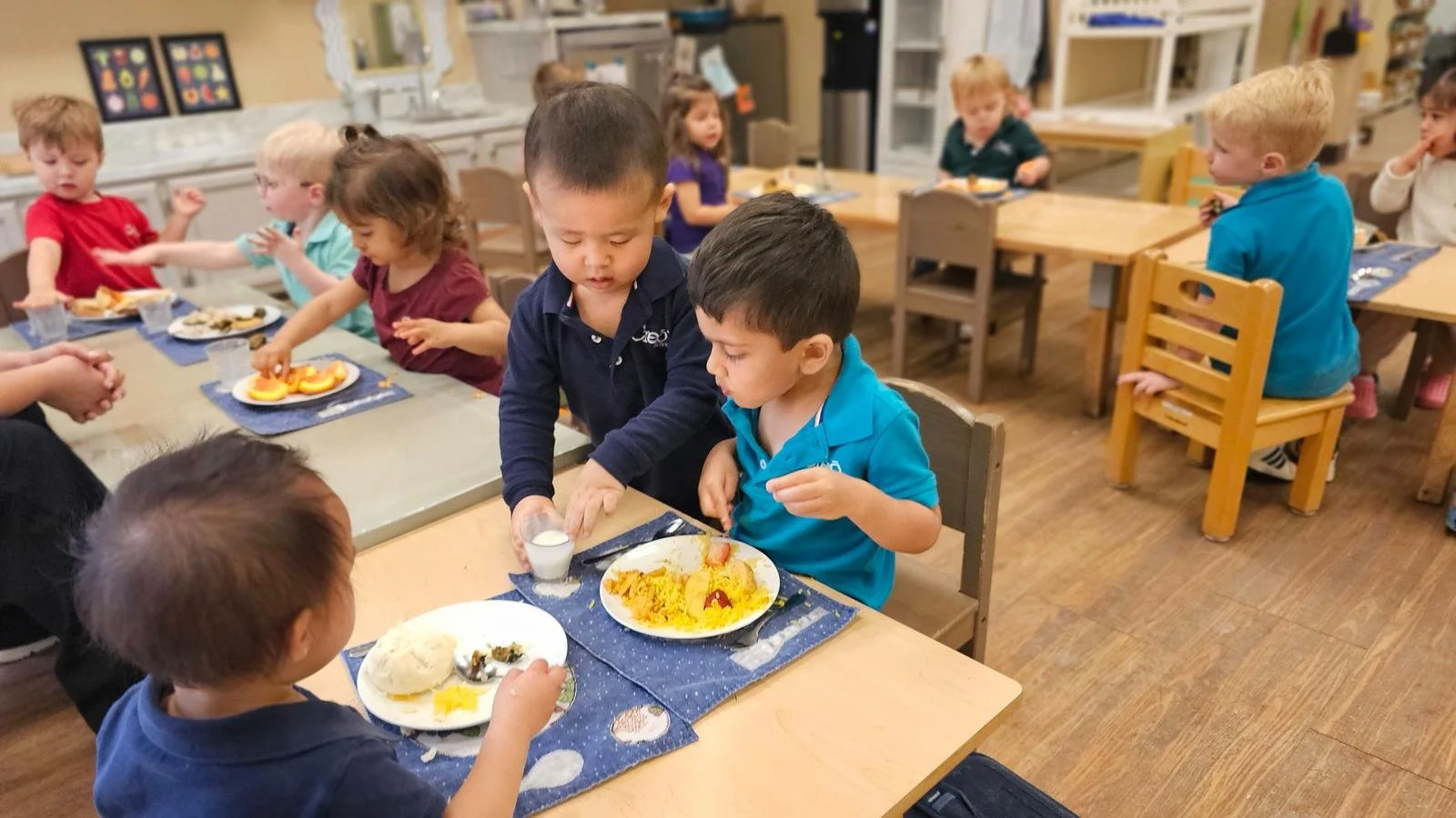 Eddy serving milk during lunch.jpg