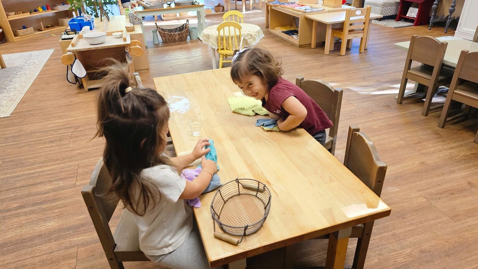 Alana and Zara folding laundry.jpg