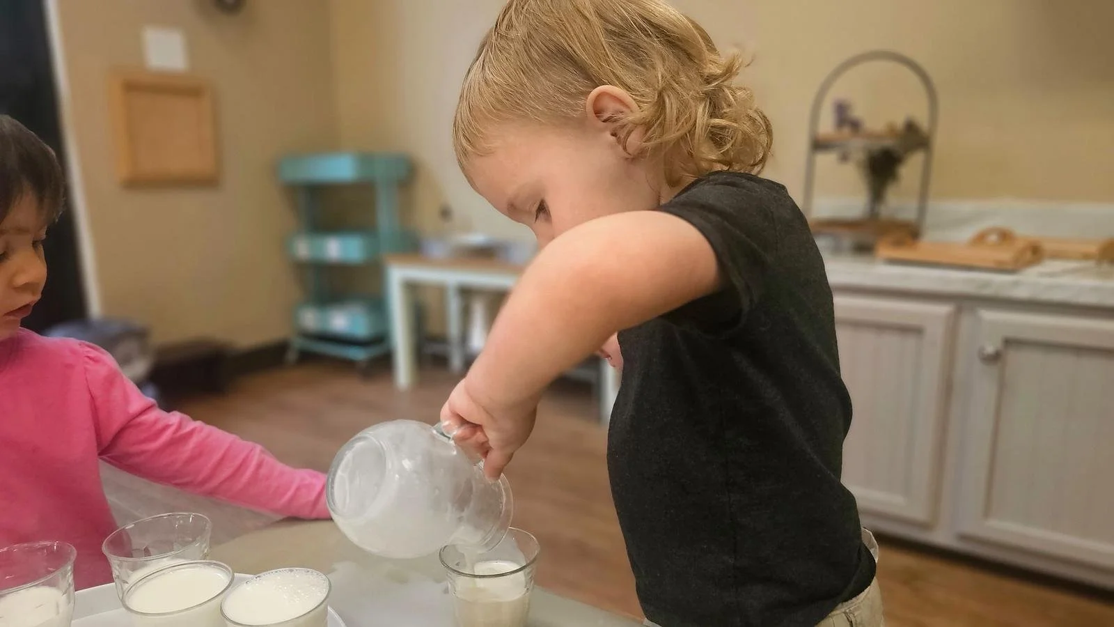 Beckham pouring milk.jpg