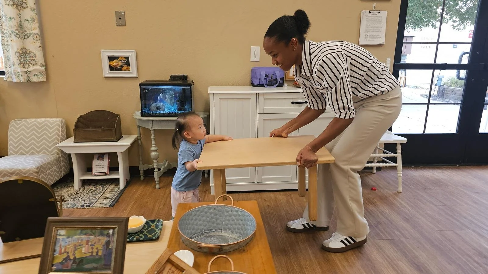 Leona and Kayla carrying table.jpg