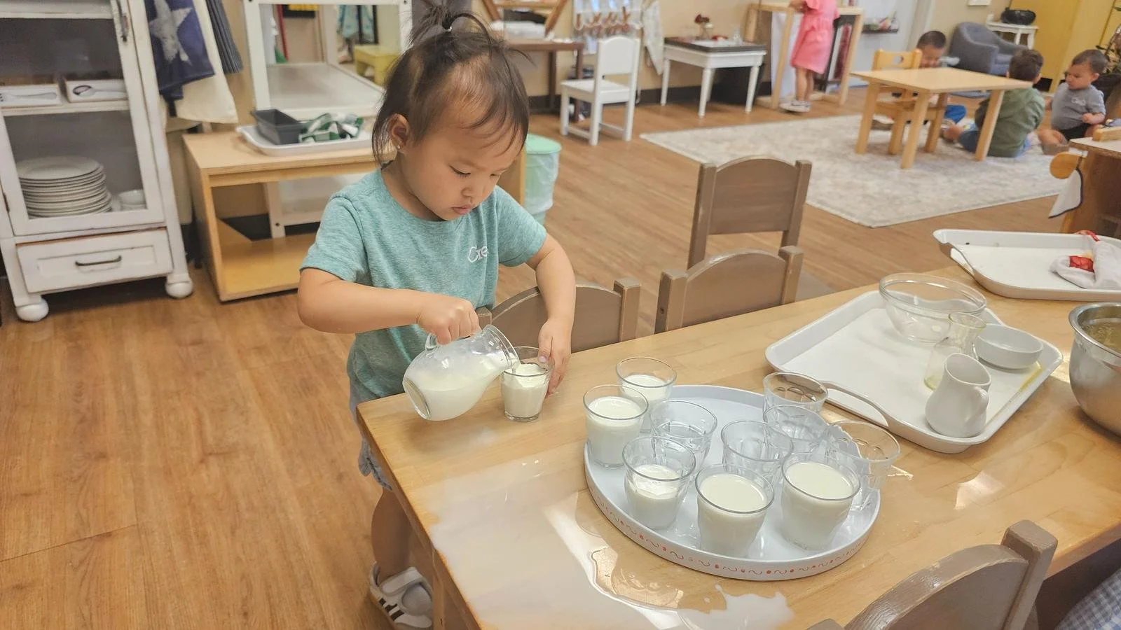 Amelia pouring milk.jpg