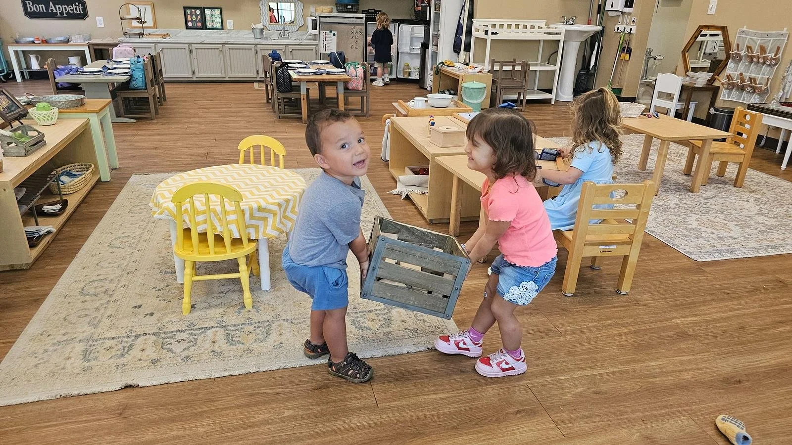 Camden and Alana carrying crate.jpg