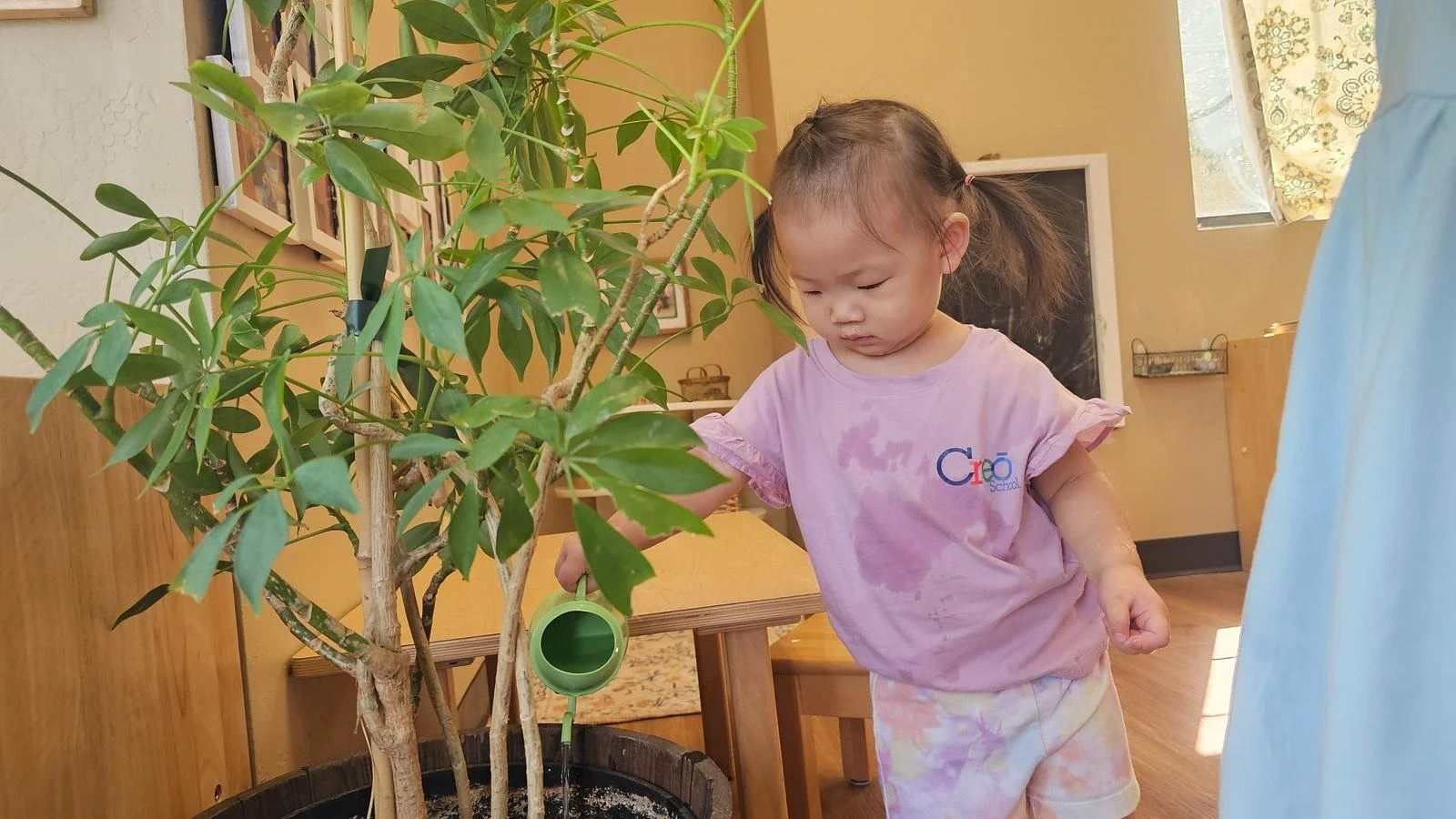 Leona watering plants.jpg