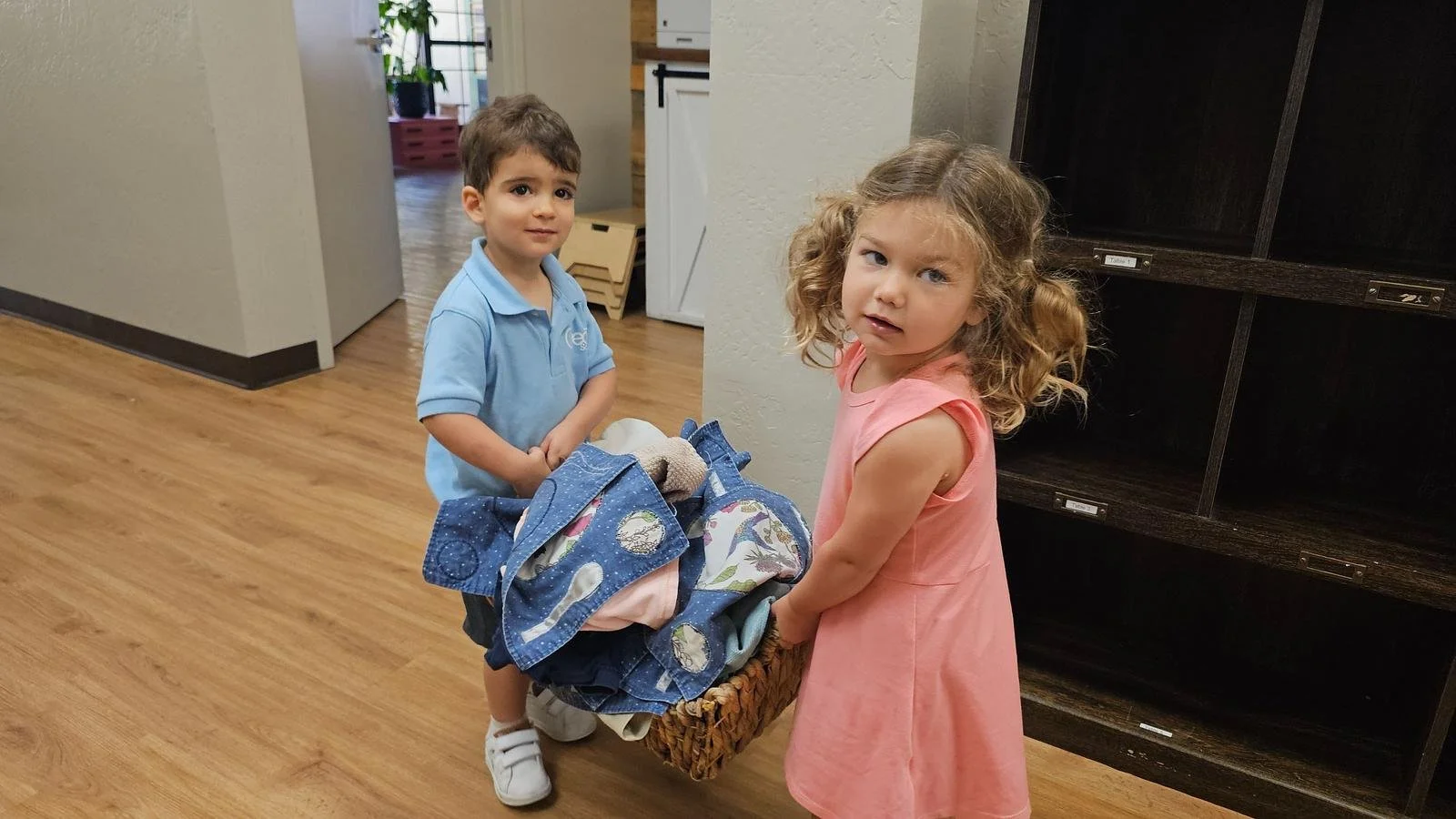 Sebastian and Ryder carrying laundry.jpg