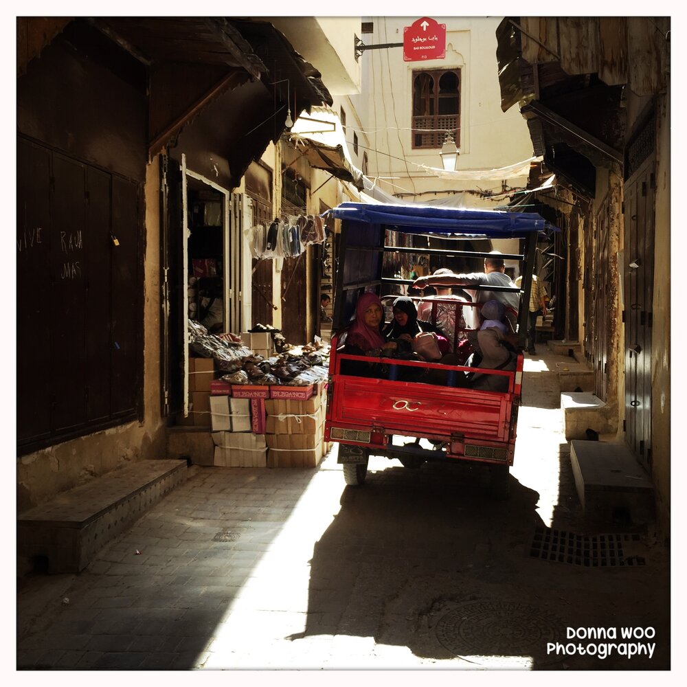  Always nervous for all the trucks, albeit tiny, speeding through the narrow streets of the medina.  May 2015.  Fez, Morocco 