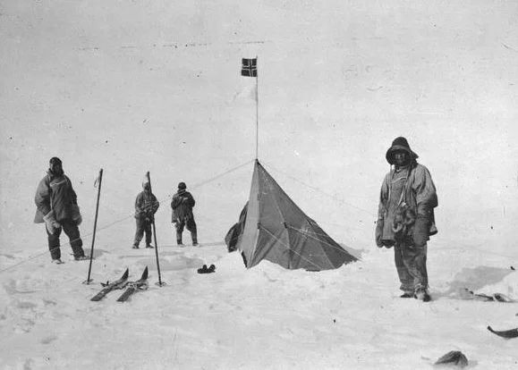 Captain Scott and his team by the Norwegian tent left by Amundsen at Polheim (Norwegian for "Home of the Pole"). Photo: Wikipedia