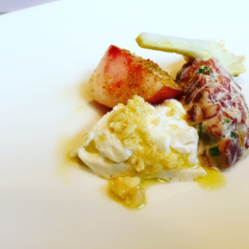 Tartare of milk fed veal with burratina, white peach, artichoke and fennel pollen
