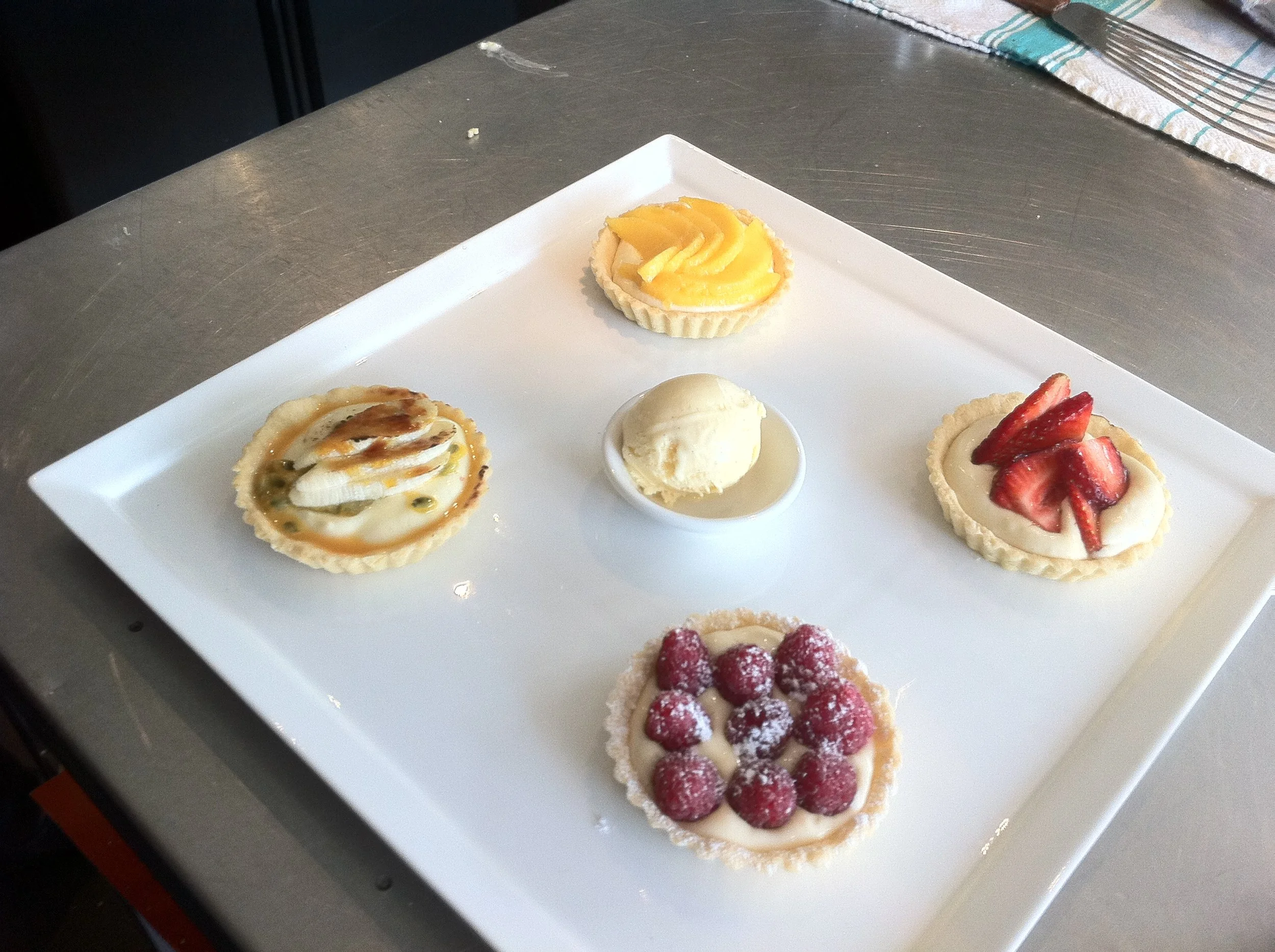 Four small sweet tarts