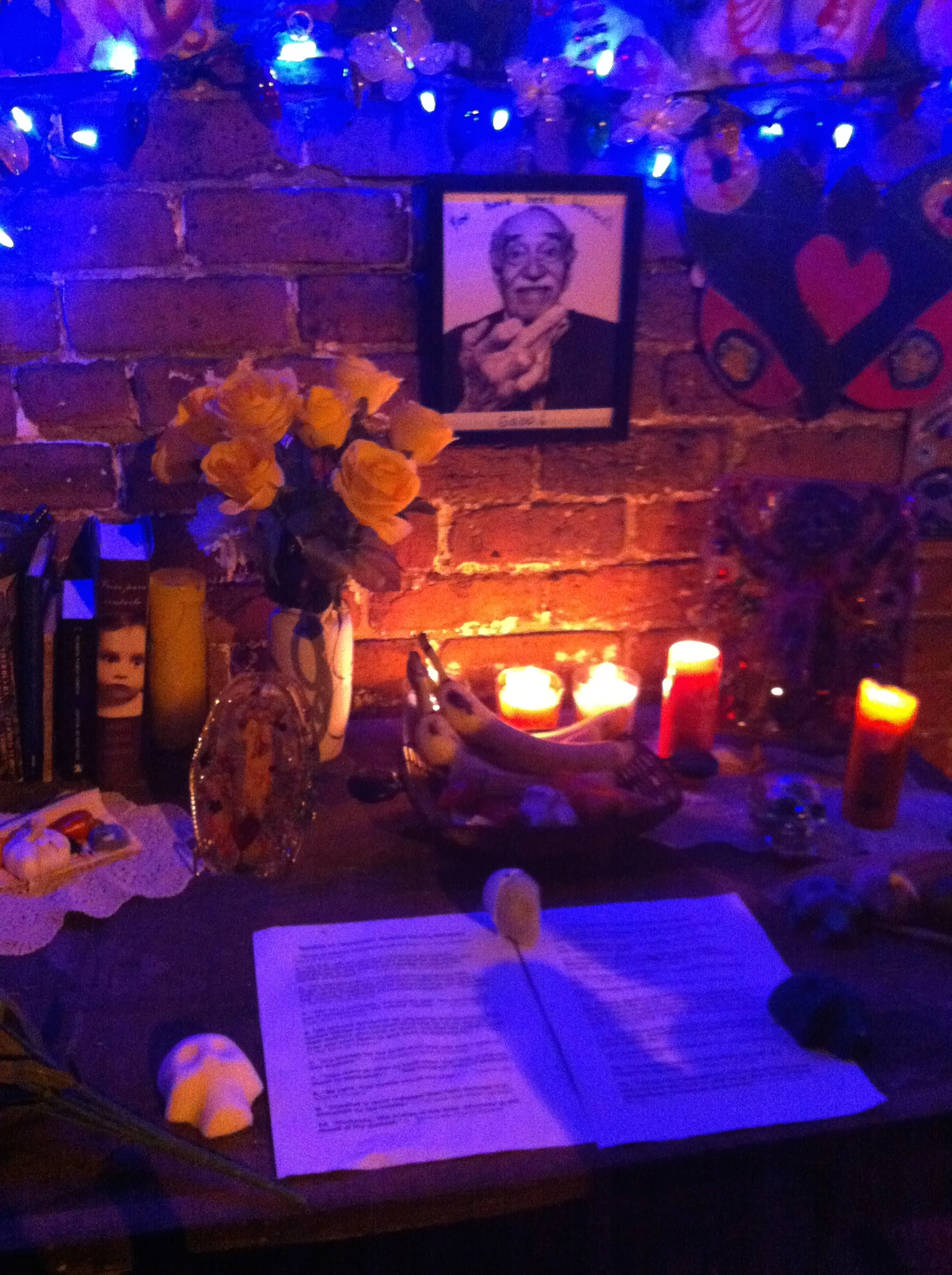 The ofrenda, or offering, to Gabriel Garcia Marquez at Dia de Los Muertos. The ofrenda consisted of a writing desk on which sat several of his books, candles, yellow roses, sugar skulls, pages of his quotes, and some of his favorite foods. 