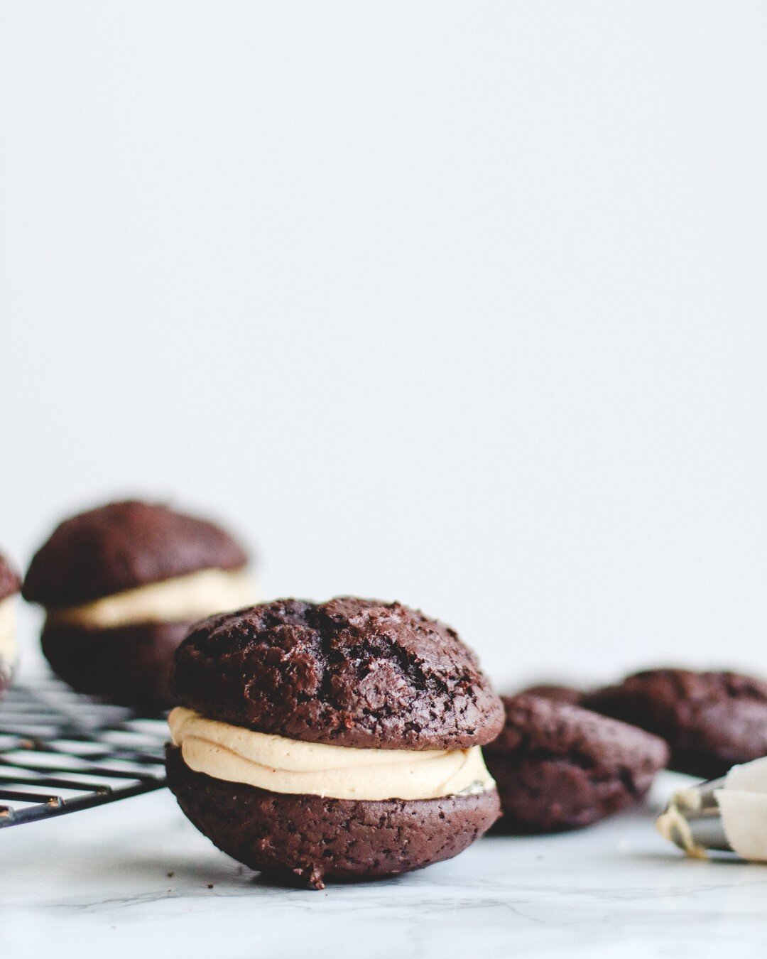 Chocolate peanut butter whoopie pies. They&rsquo;re like the cheeseburger of cookies and I love it. ⠀⠀⠀⠀⠀⠀⠀⠀⠀
⠀⠀⠀⠀⠀⠀⠀⠀⠀
Taste testing and perfecting upcoming projects. We cannot wait!