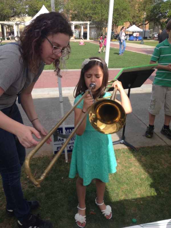 Last year we made a lot of people happy at Arts Alive! Children and adults stopped by to play on over 40 instruments at our booth.
