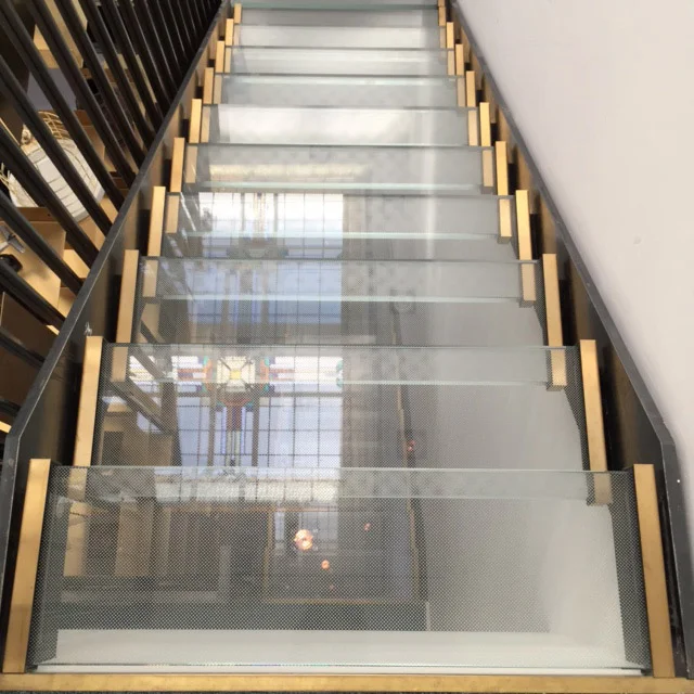Glass and brass staircase at Vesper Hotel | Design Hunter