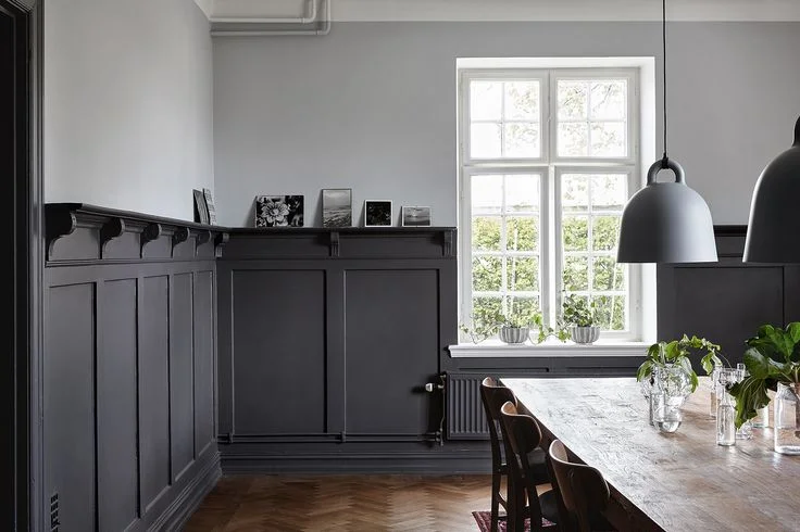 Dining room with herringbone parquet floor and painted wall panelling