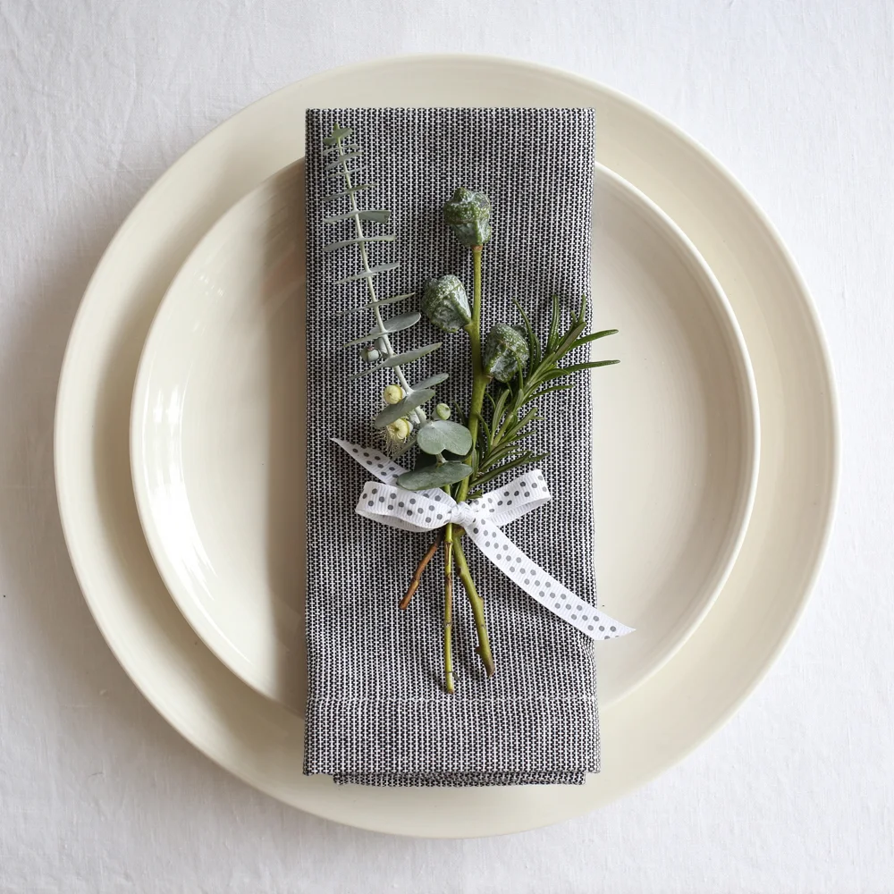 Christmas place setting with grey napkins & eucalyptus | Design Hunter