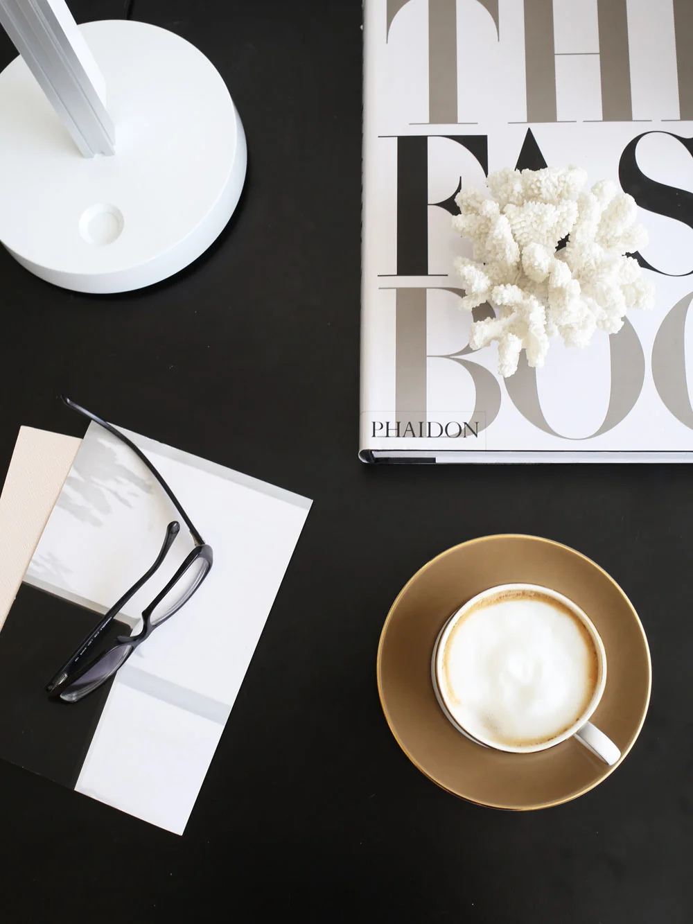 Desktop with coffee and Jake Dyson lamp