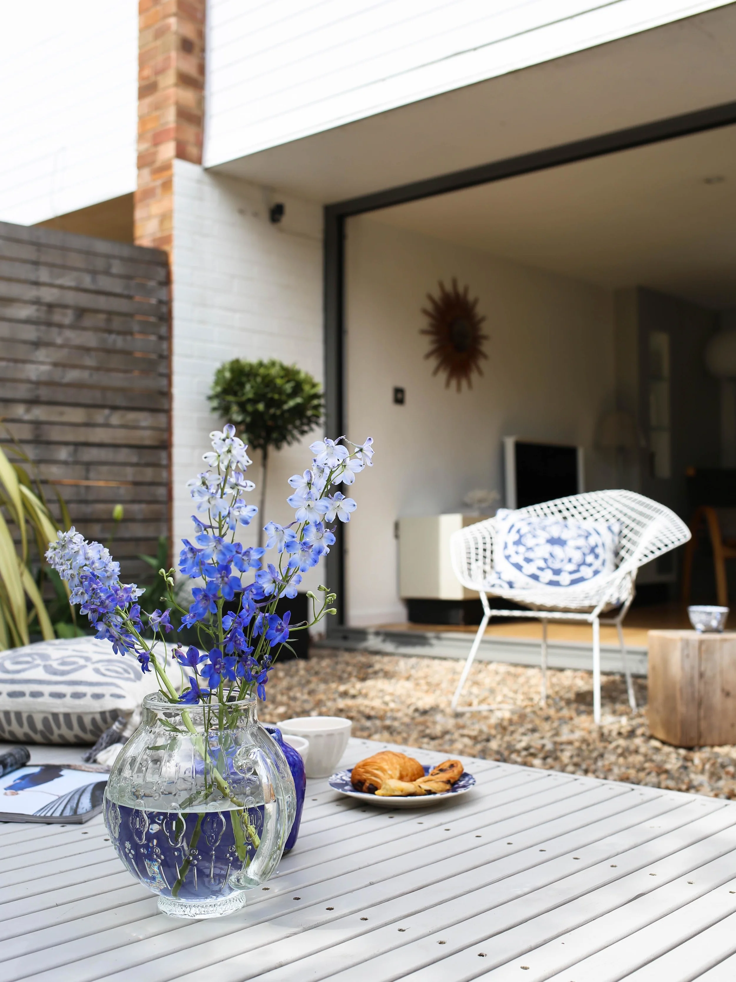 Blue delphiniums in glass jug | Design Hunter