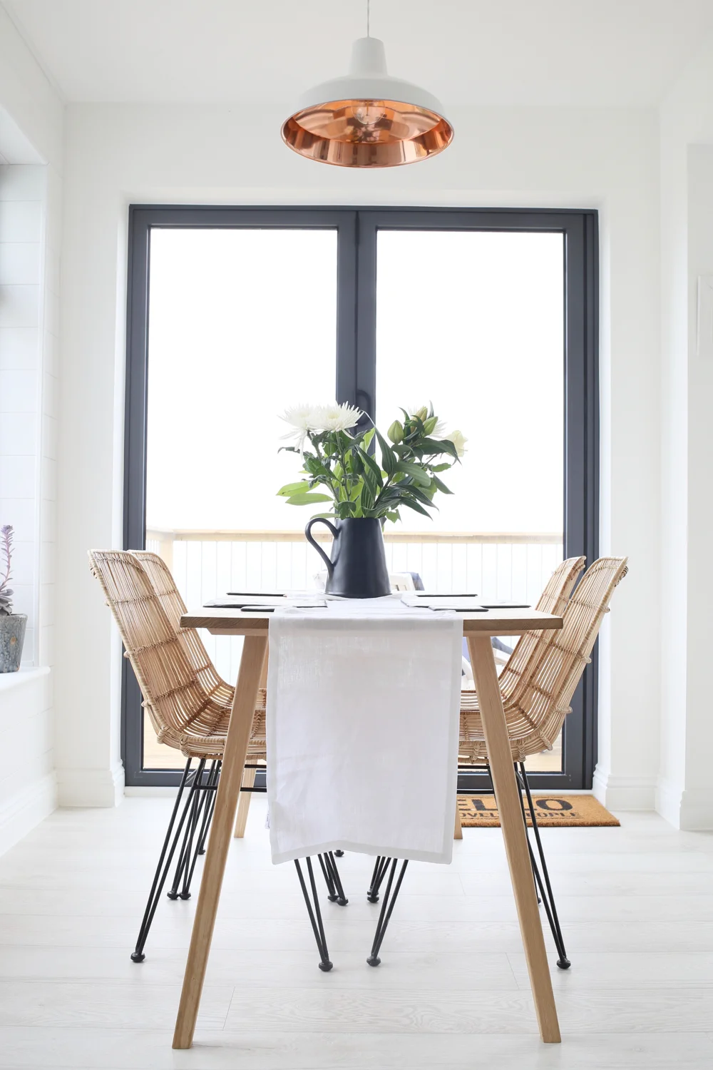 Dining table with rattan chairs | Design Hunter