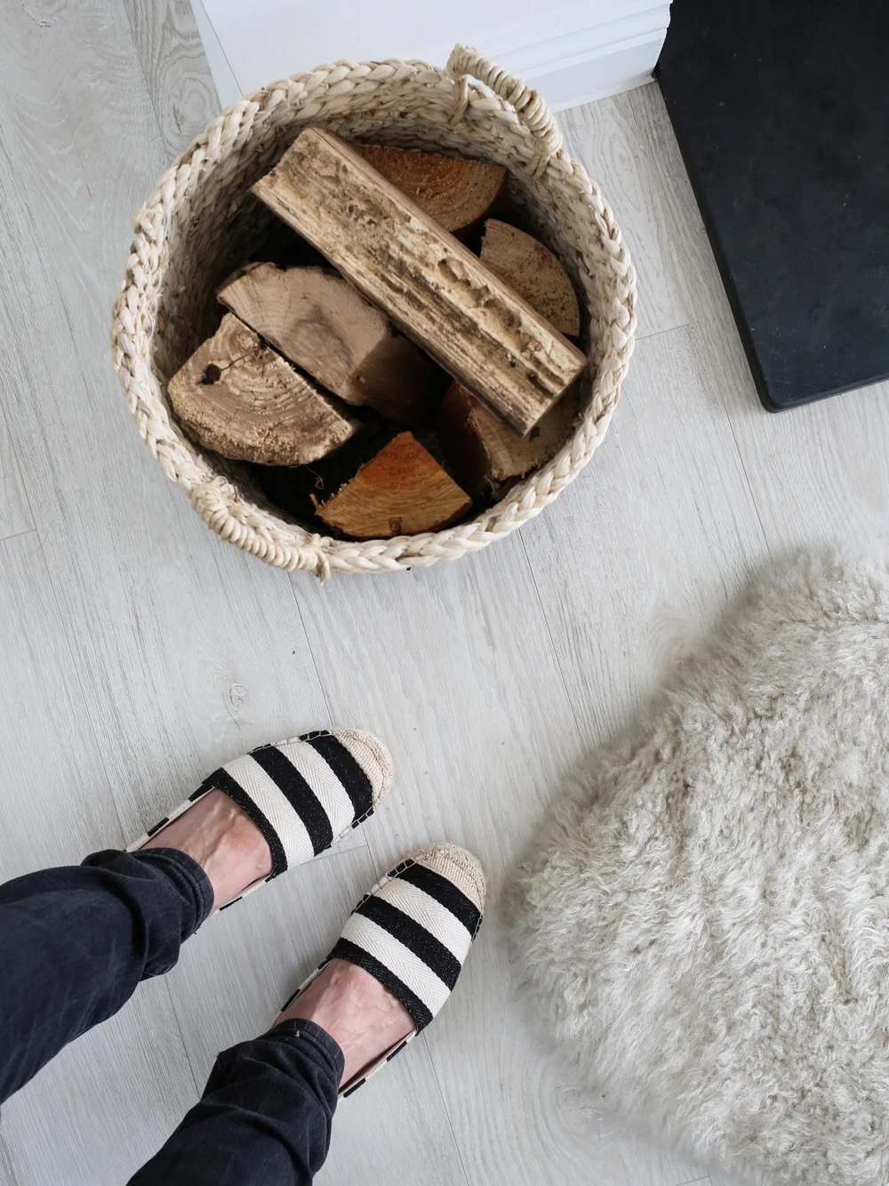 Fire logs and fur rug | Design Hunter