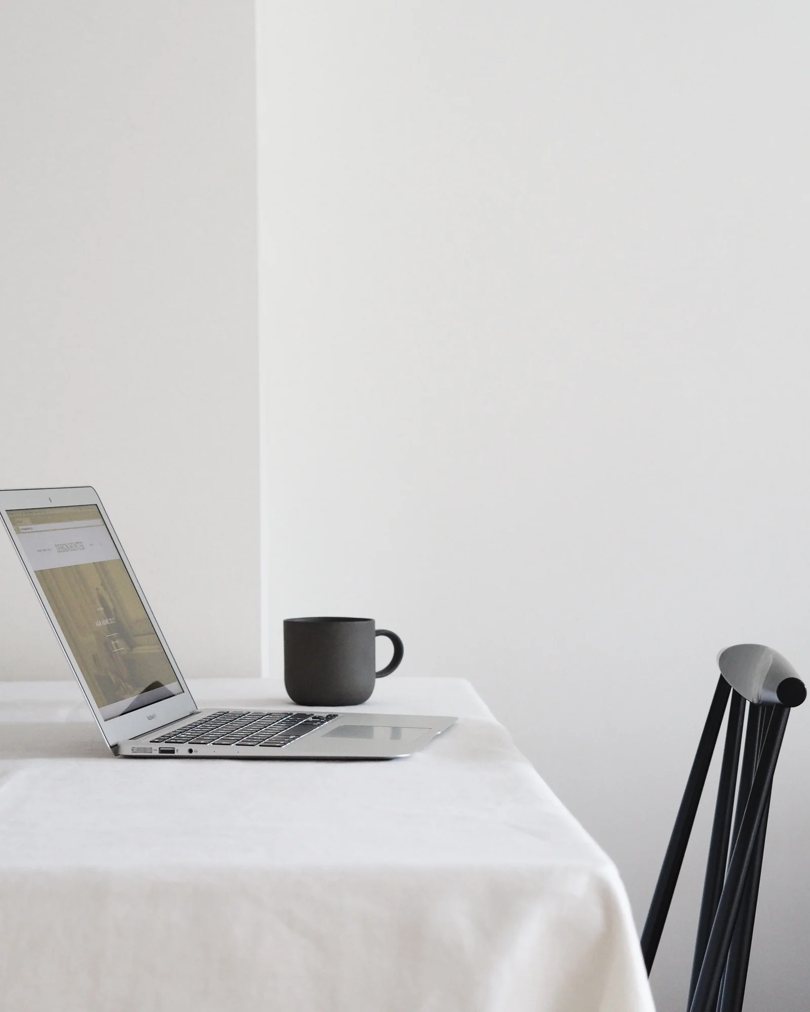 Laptop and mug on table